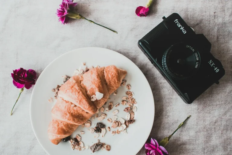 A beautifully arranged flatlay of assorted food items on a wooden table