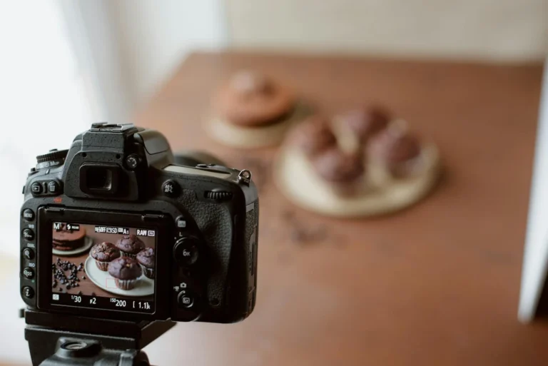 A professional camera capturing a beautifully arranged dish in food photography.