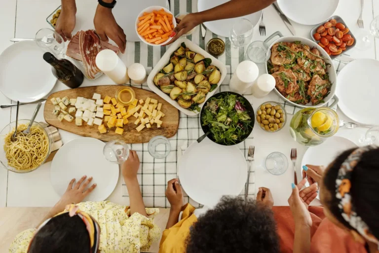 A family enjoying a well-planned meal at a kitchen table, illustrating meal planning for busy families.