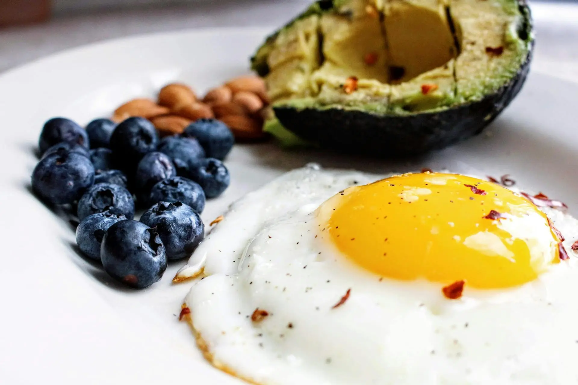 A plate with a balanced post-workout meal, including grilled chicken, quinoa, and a variety of vegetables.