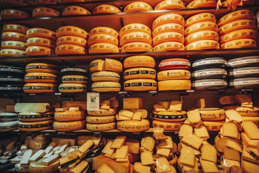 A selection of artisanal cheeses displayed at a cheese maker's shop, ready for themed food tours.