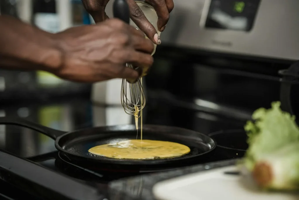 Pouring Eggs Into The Pan for make omelettes